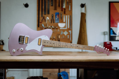 Indiana electric guitar in Burgundy Mist finish on workbench