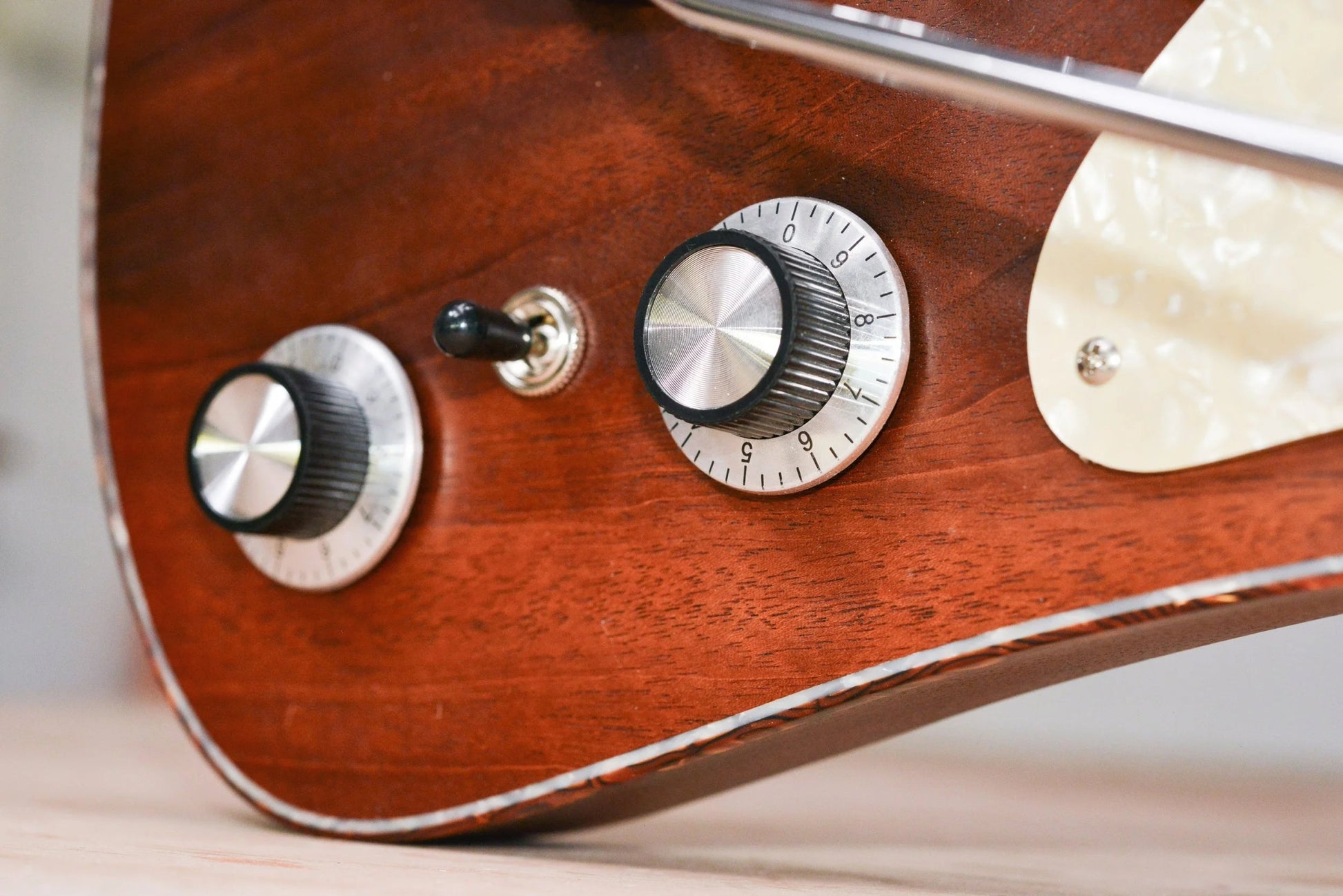 Close-up of Indiana Classic control knobs and mahogany top